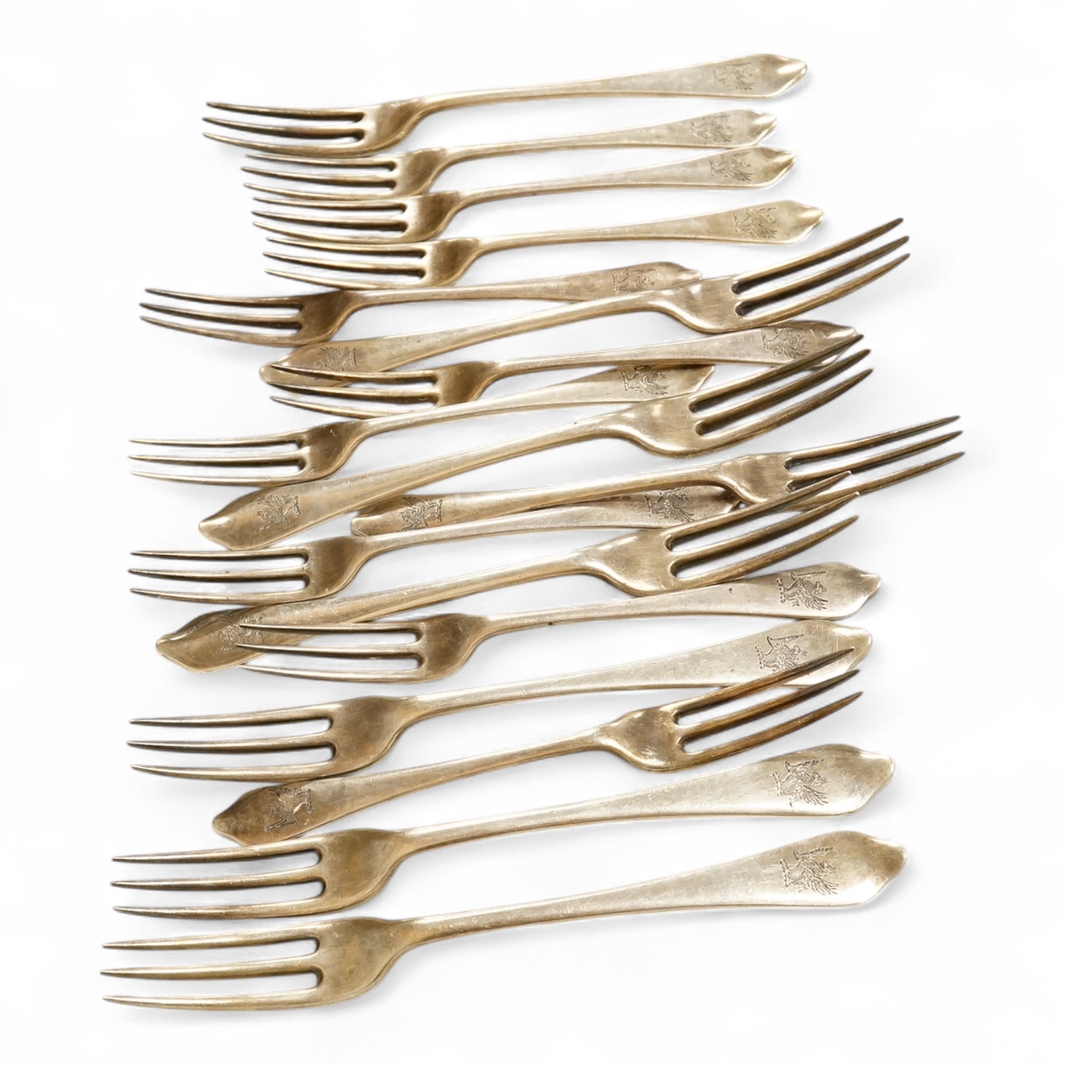 A set of seven late Victorian silver dog-nose three pronged table forks and ten matching dessert forks, all with engraved crest, Francis Higgins’s III, London, 1889, table fork length 19.5 cm, 34.5 oz.
